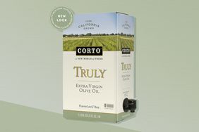 The Corto Olive Oil on a two tone green background. 