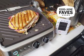A sandwich cooking on a Breville The Sear and Press Countertop Electric Grill