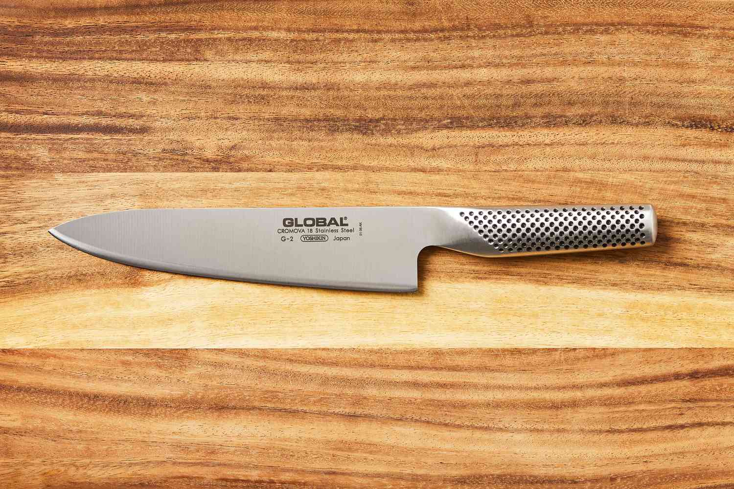 Global 8-Inch Chef's Knife on a wooden cutting board