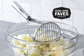 Potato Masher in a bowl of potatoes