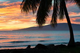 The sun sets over the Hawaiian shores of Olowalu, Maui