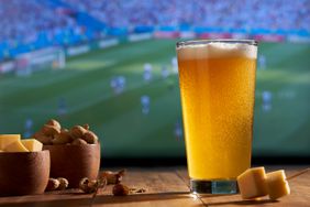 The World Cup on a TV with a glass of beer and snacks